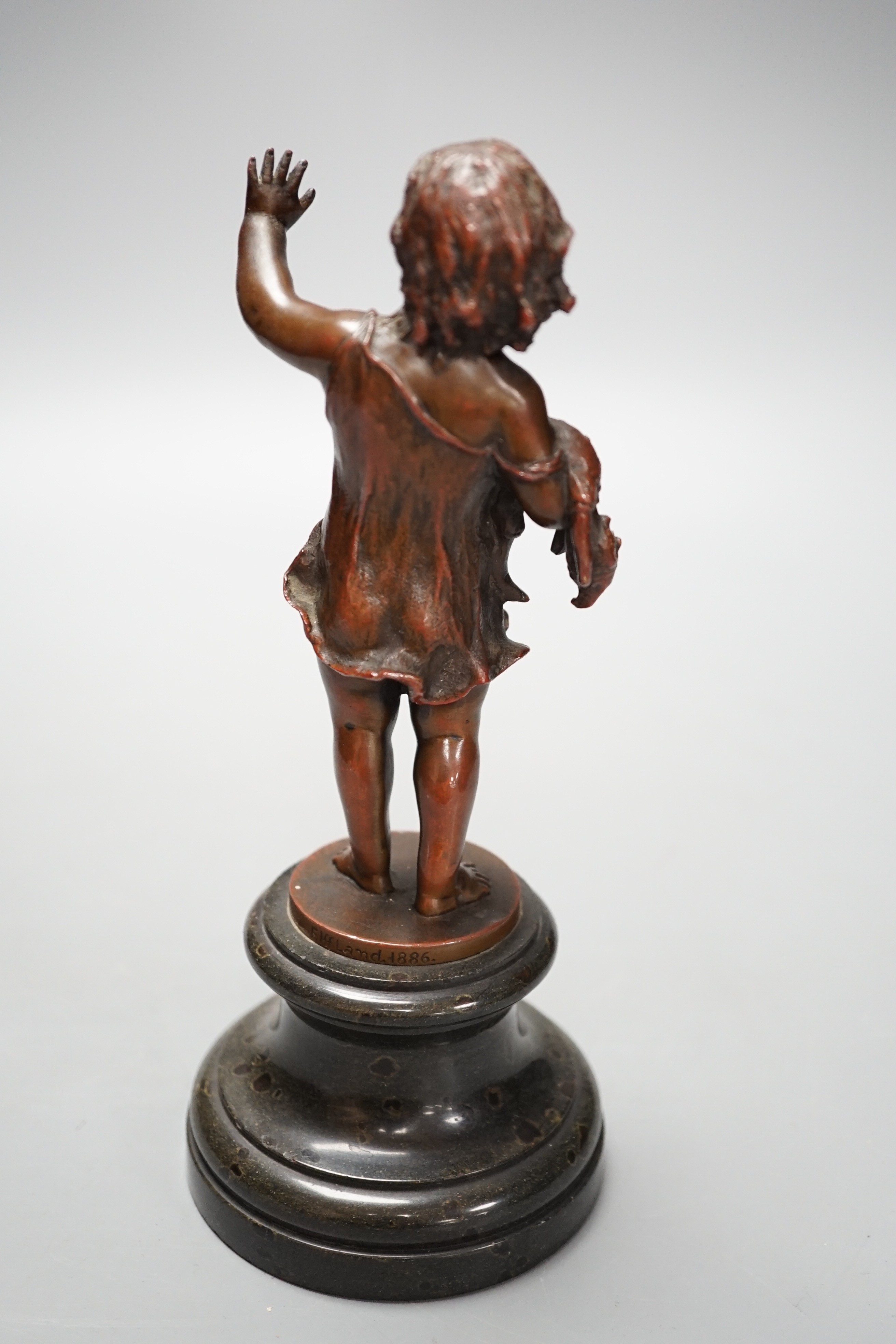 Franz Iffland (German, 1862-1935), bronze of a child holding a Punch puppet, dated 1886 20cm